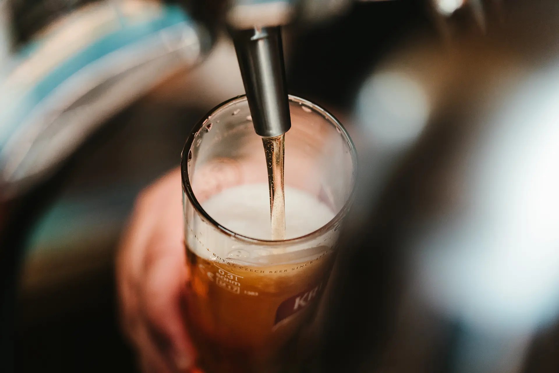 bartender pouring a beer
