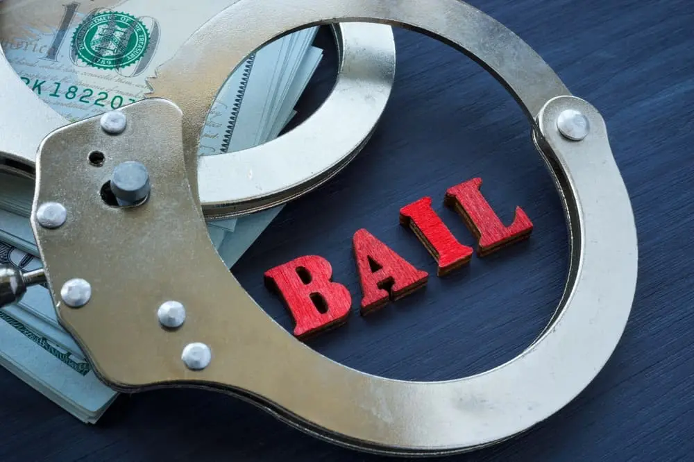 ail bonds concept. The handcuffs are on the dollars.