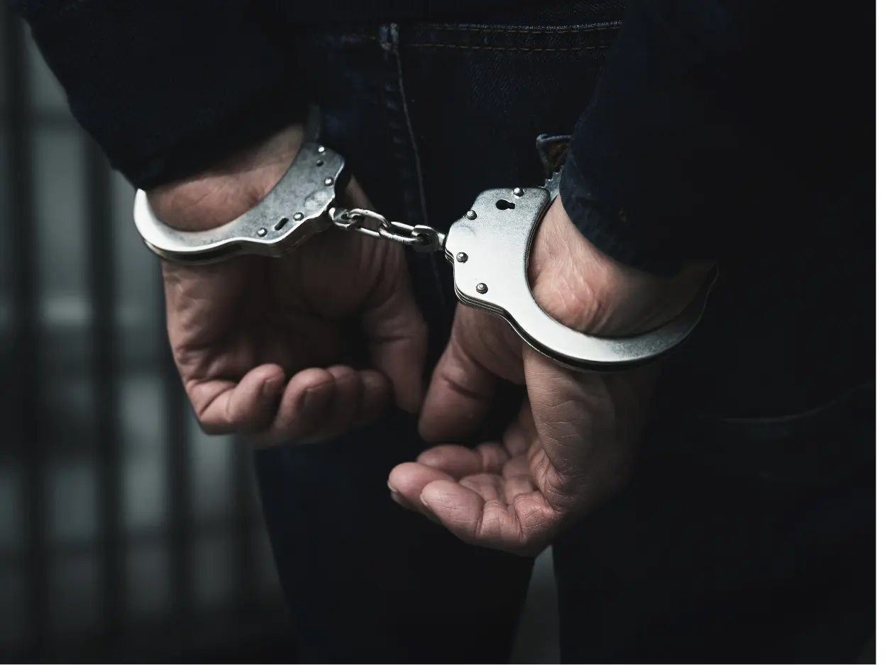 Person in handcuffs after a felony arrest in Collin County Texas