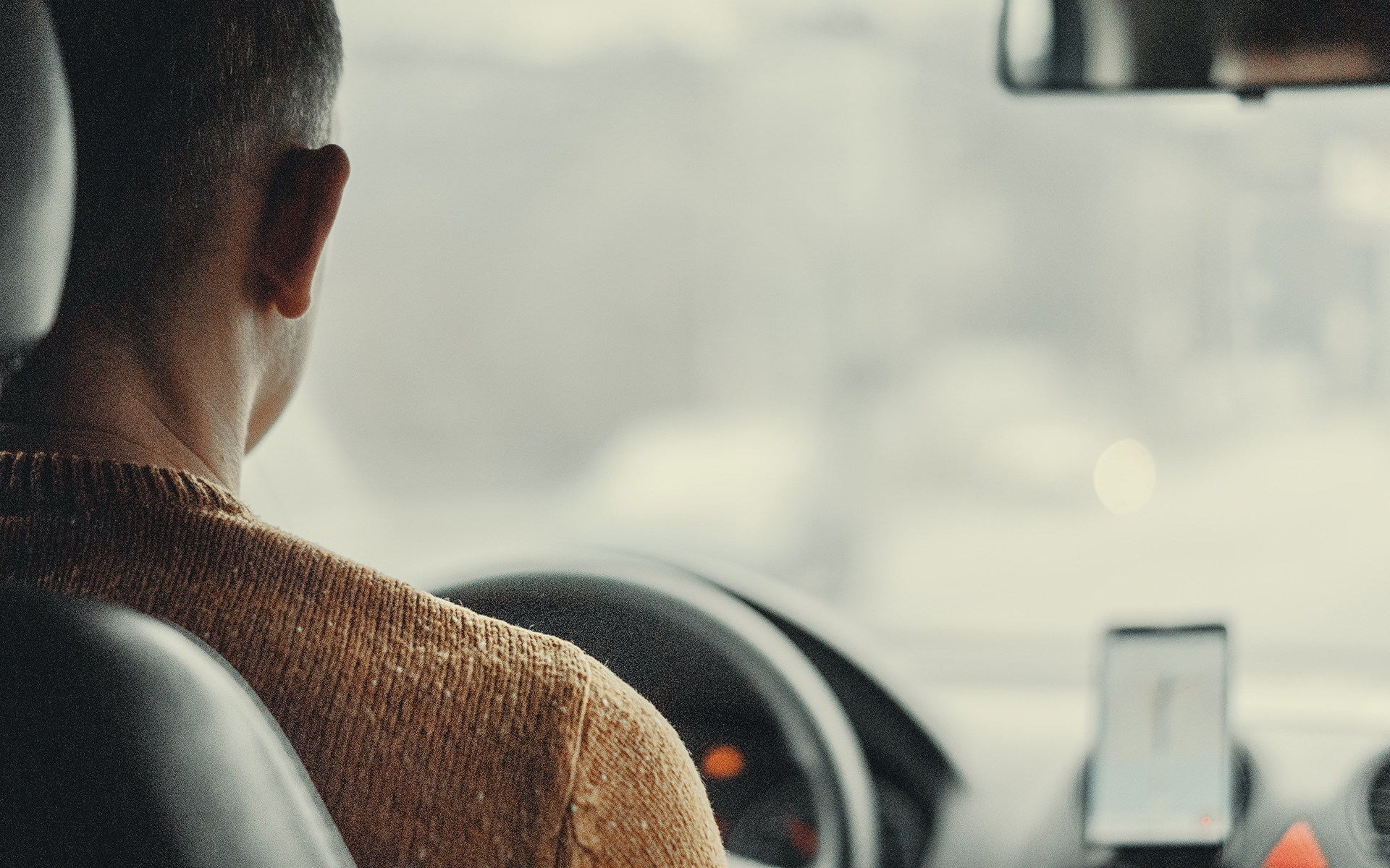 person sitting in a car