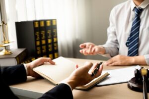 The criminal lawyer and client discuss the defense strategy